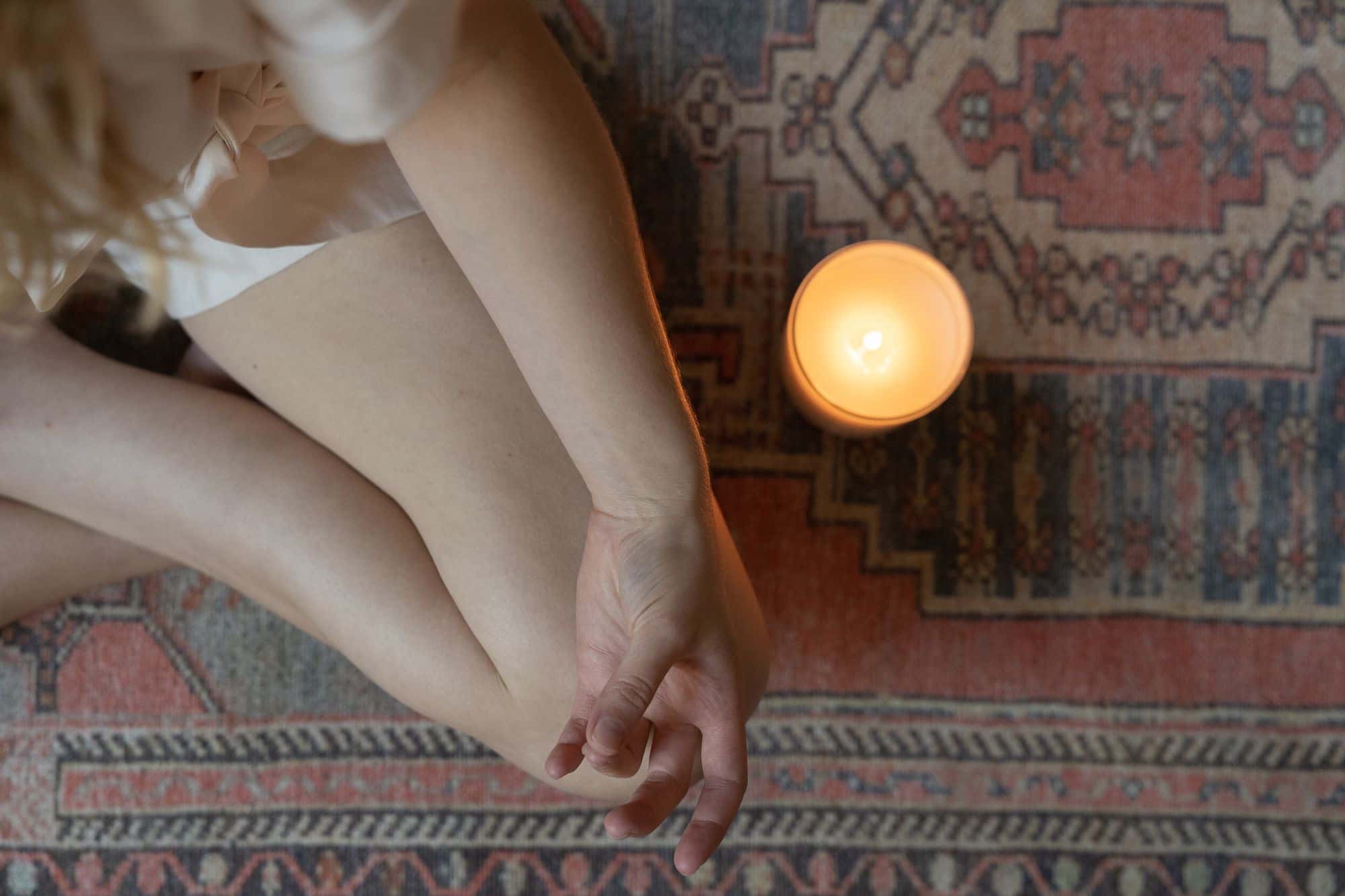 A warm candle glowing softly in a calm room